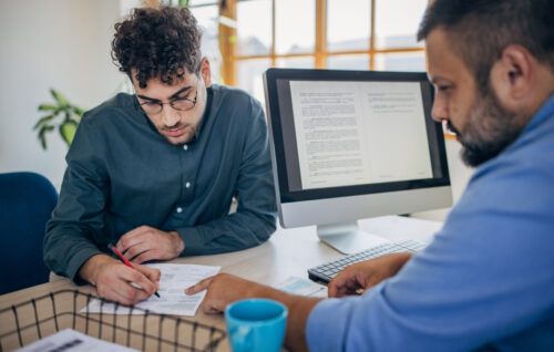 Man on job interview showing 10 MORE things not to do on your CV