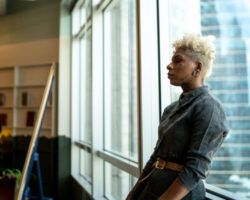 Worried woman in classroom dealing with imposter syndrome