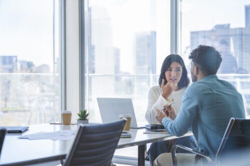 Man and woman conducting Exit interview