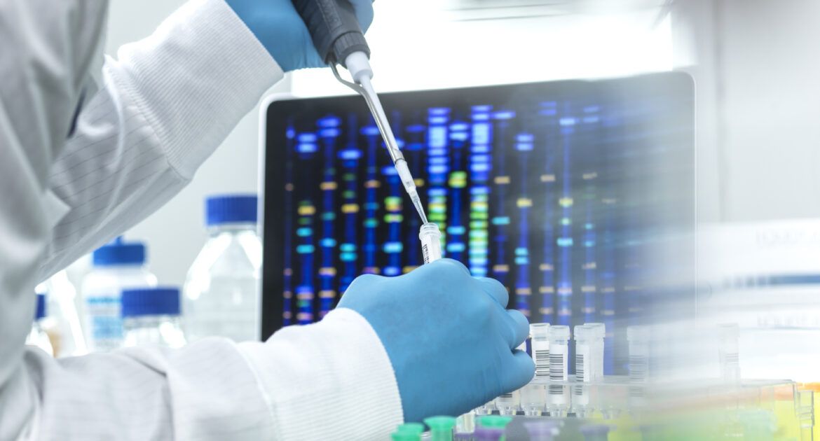 Scientist pipetting sample into a vial for DNA testing