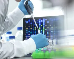 Scientist pipetting sample into a vial for DNA testing