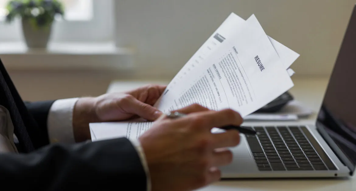 Businessman or HR Manager is reviewing CV information