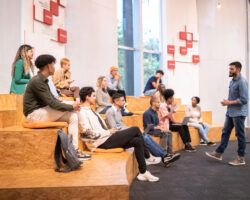 University students watching a lecture at university auditorium