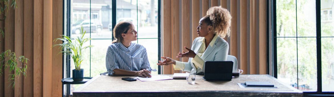 Mentor and mentee Having a Meeting at the Office