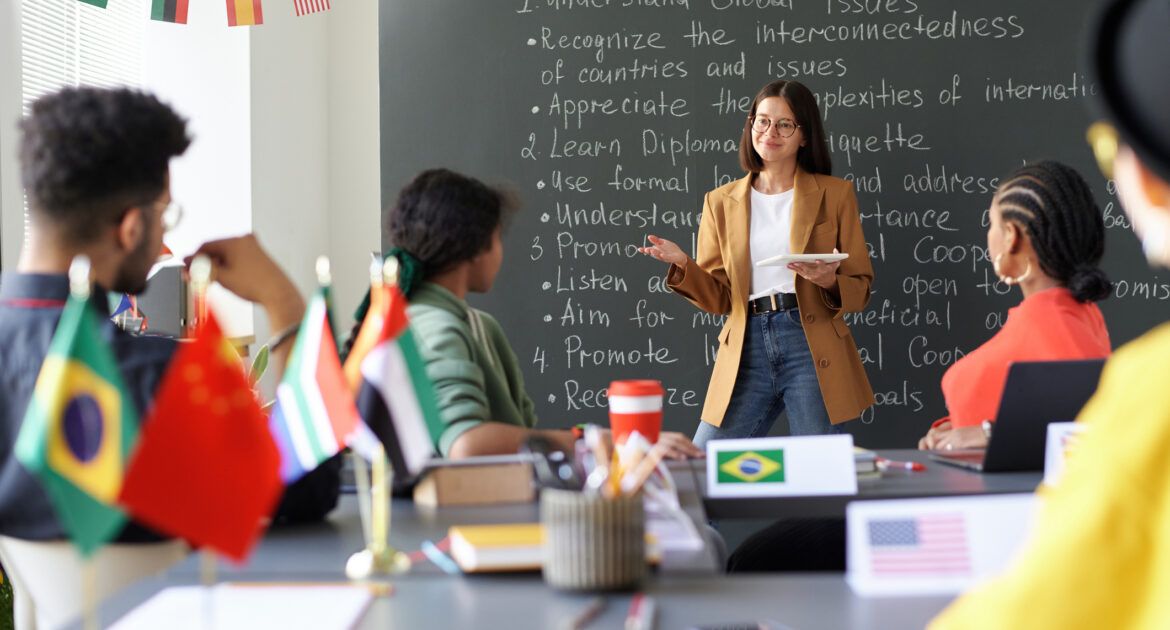 Teacher explaining material to students at lesson