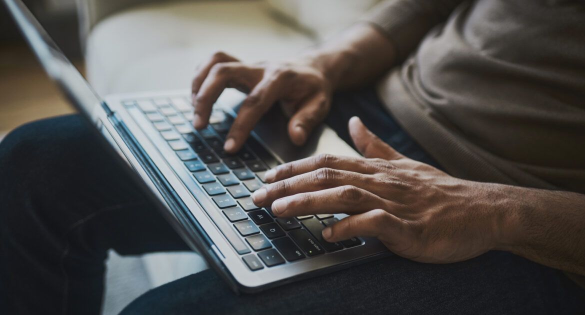 Fingers of a Businessman writing a cover letter