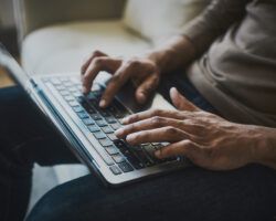 Fingers of a Businessman writing a cover letter