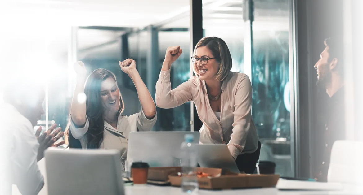 Team celebrating, showing employee happiness