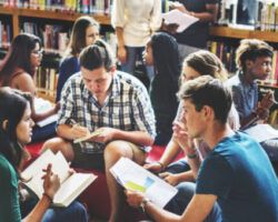 students reading in a library researching learning styles