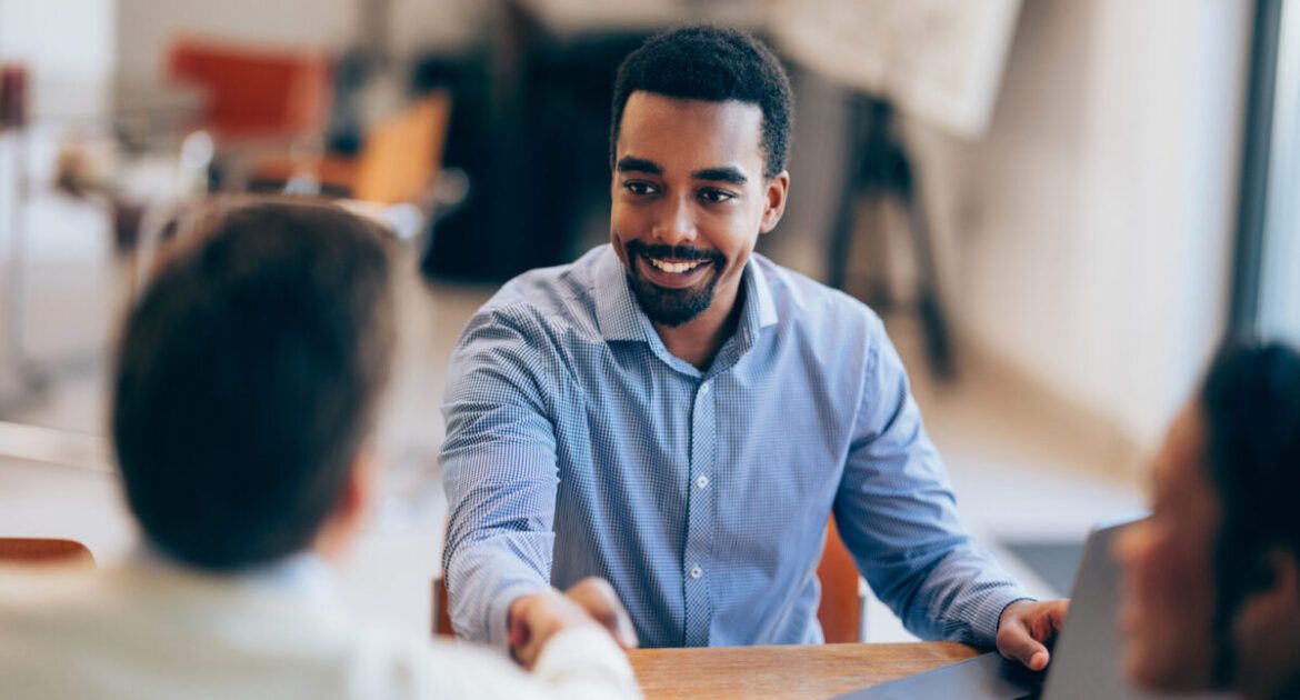 Confident man Shaking Hands During a Meeting at Modern Office