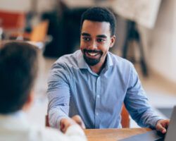 Confident man Shaking Hands During a Meeting at Modern Office