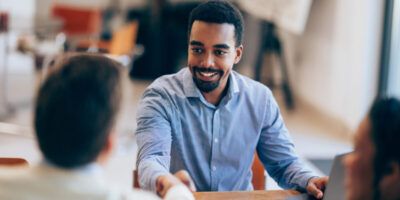 Confident man Shaking Hands During a Meeting at Modern Office