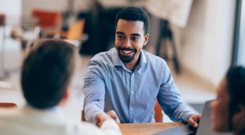 Confident man Shaking Hands During a Meeting at Modern Office