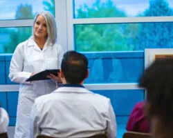 Female Healthcare Instructor with Multiracial Group Clinical Classes and Training Medical Staff in Western USA Photo Series