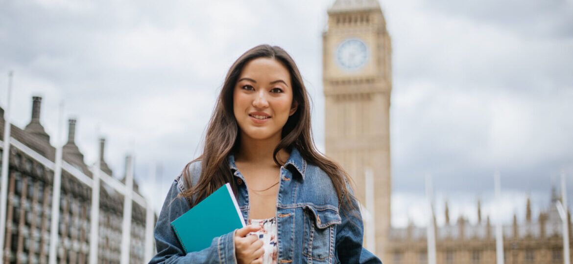 Happy Asian female student in London