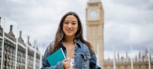 Happy Asian female student in London