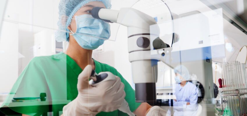 Molecular Geneticist conducting research in a lab