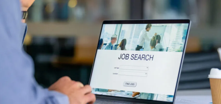 Close up of a man looking at a job search recruitment web page