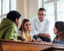 Students Engaged in Group Discussion in University Classroom
