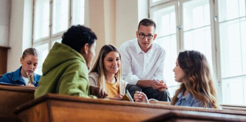 Students Engaged in Group Discussion in University Classroom