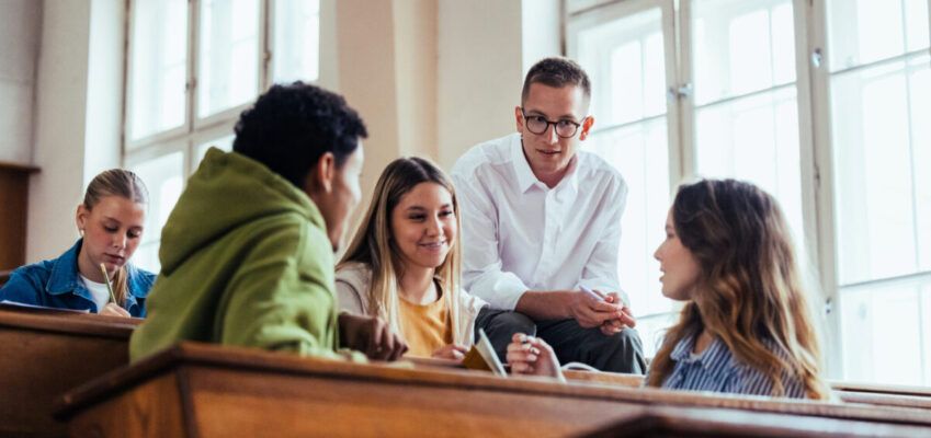 Students Engaged in Group Discussion in University Classroom