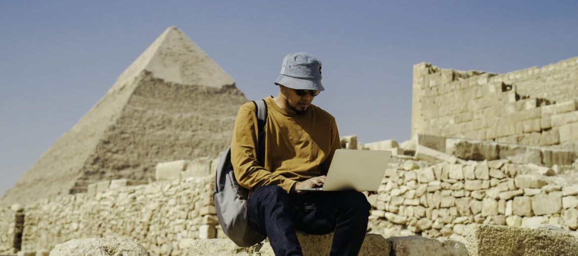 asian archaeologist working an research the pyramid pharaoh in Giza Cairo