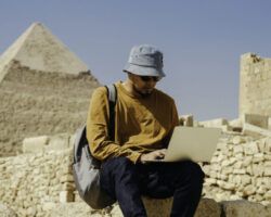 asian archaeologist working an research the pyramid pharaoh in Giza Cairo