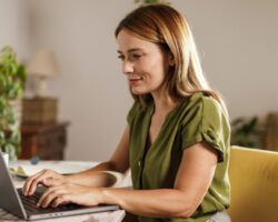Woman using laptop when working from home office