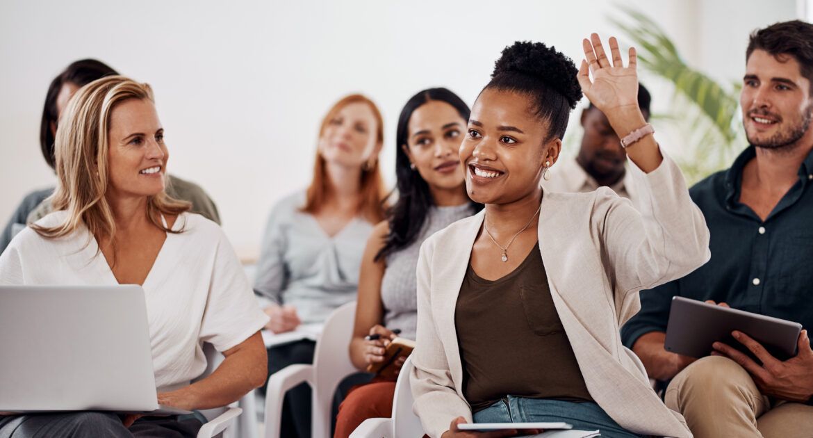 Young woman asking questions with raise hand