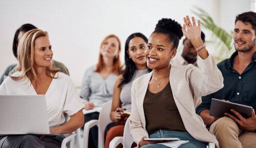 Young woman asking questions with raise hand