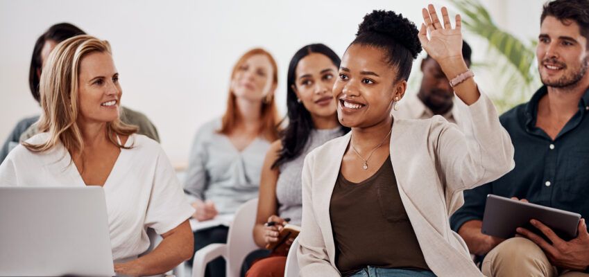 Young woman asking questions with raise hand