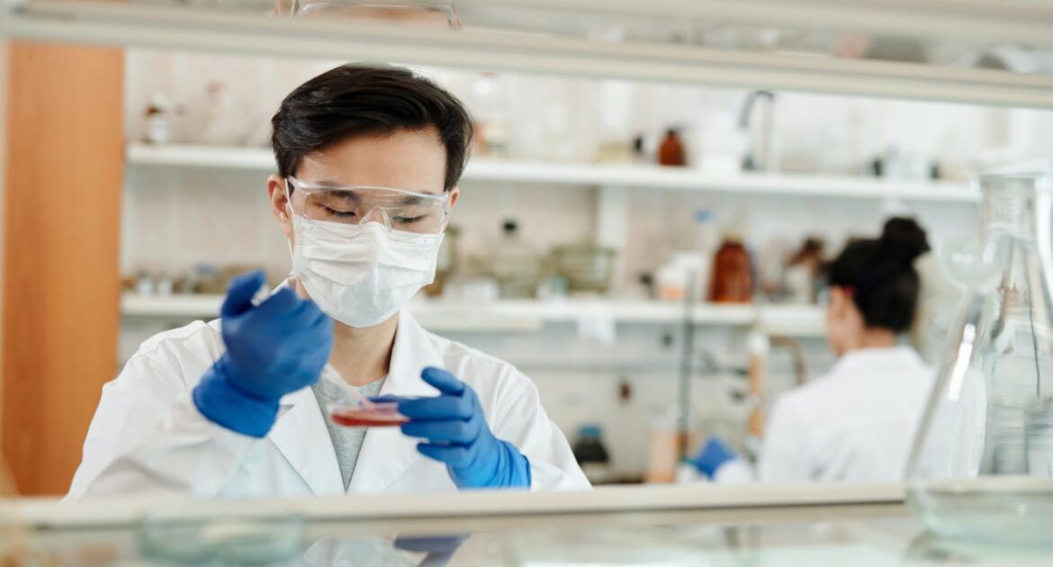 male scientist conducting experiment