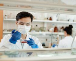 male scientist conducting experiment