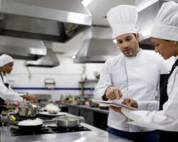 Chef talking to a student in a cooking class