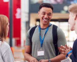 Group Of university Student Friends Meeting And Talking In Busy Communal Campus Building