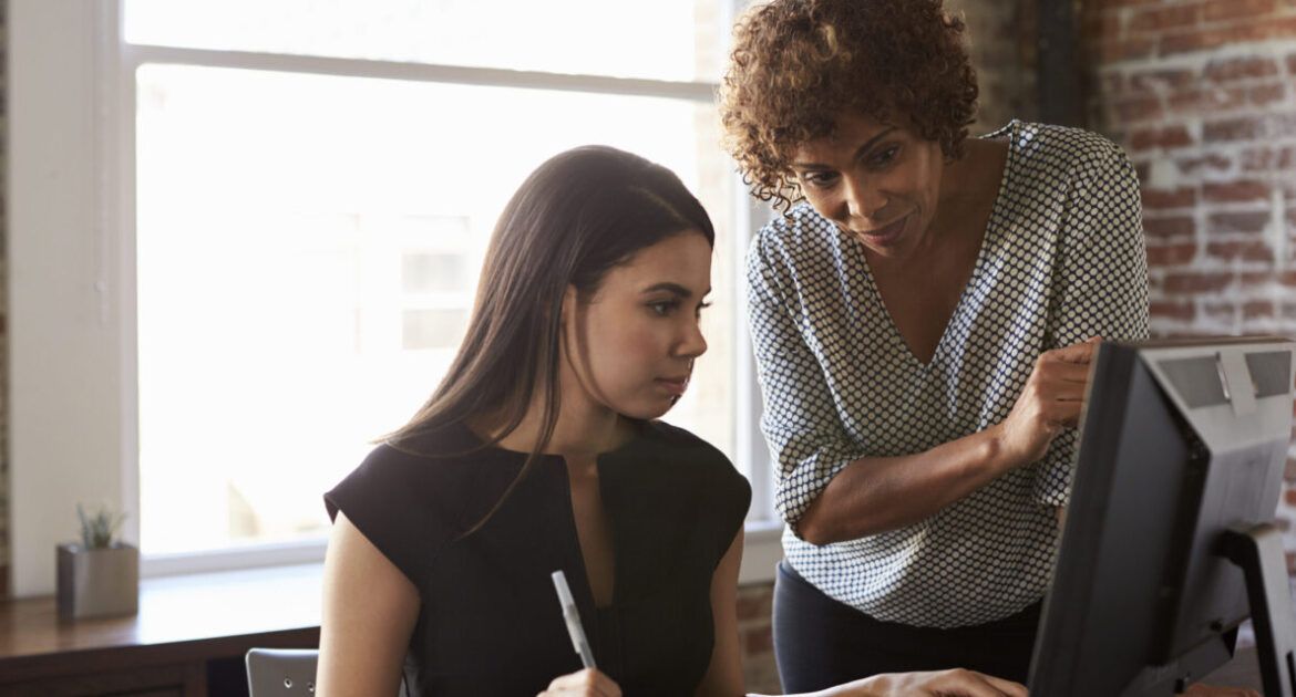 two females working together