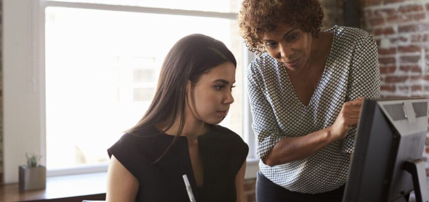 two females working together