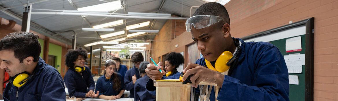 students in fe working on wood work