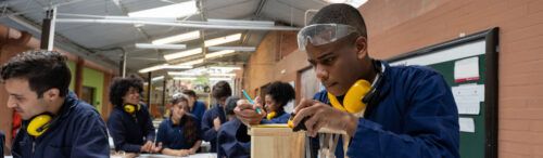 students in fe working on wood work