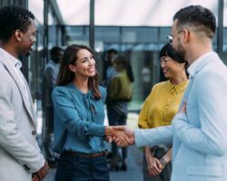 New worker shaking hands with team