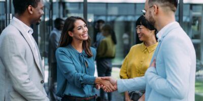 New worker shaking hands with team