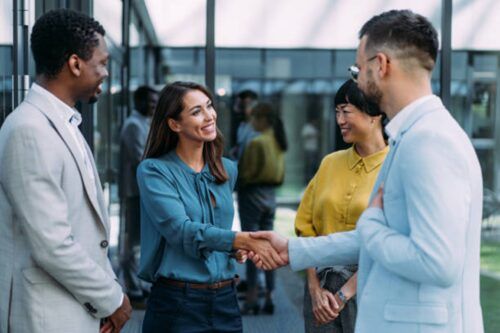 New worker shaking hands with team