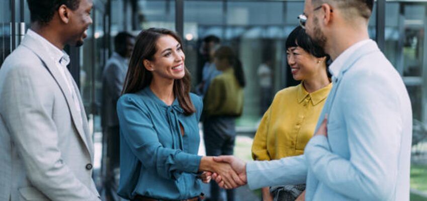 New worker shaking hands with team